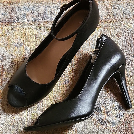 Black peep hole heels