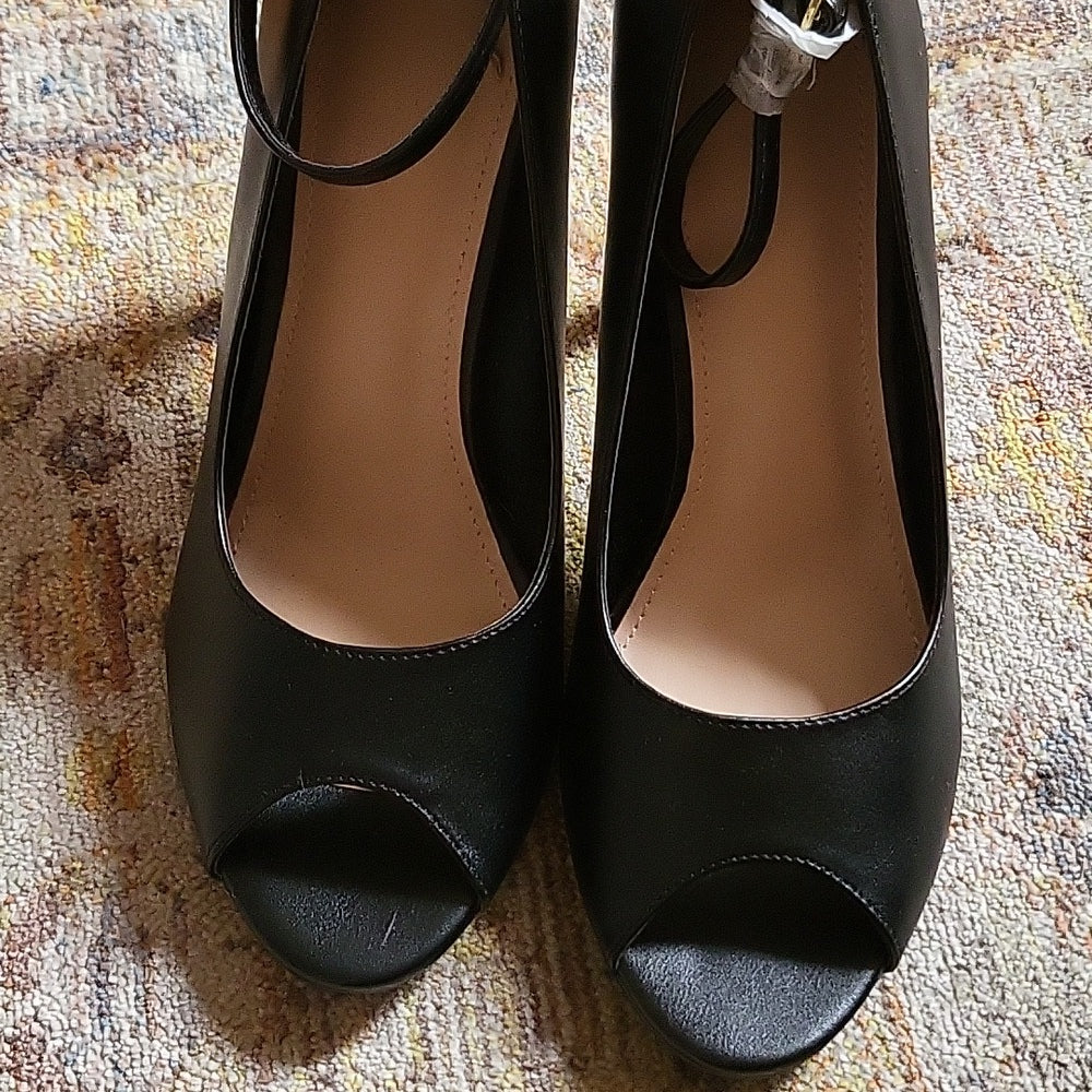 Black peep hole heels