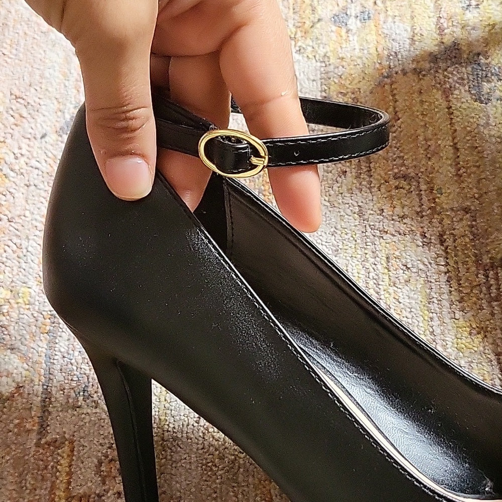Black peep hole heels